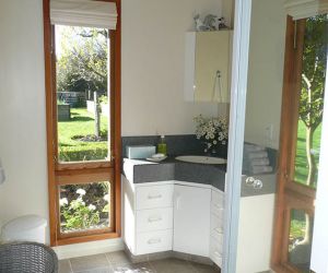 Attractive bathroom - shower, vanity unit, hair drier and heated towel rail