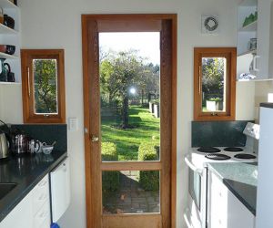 Sunny kitchen - dish washer, stove, large refrigerator and microwave oven